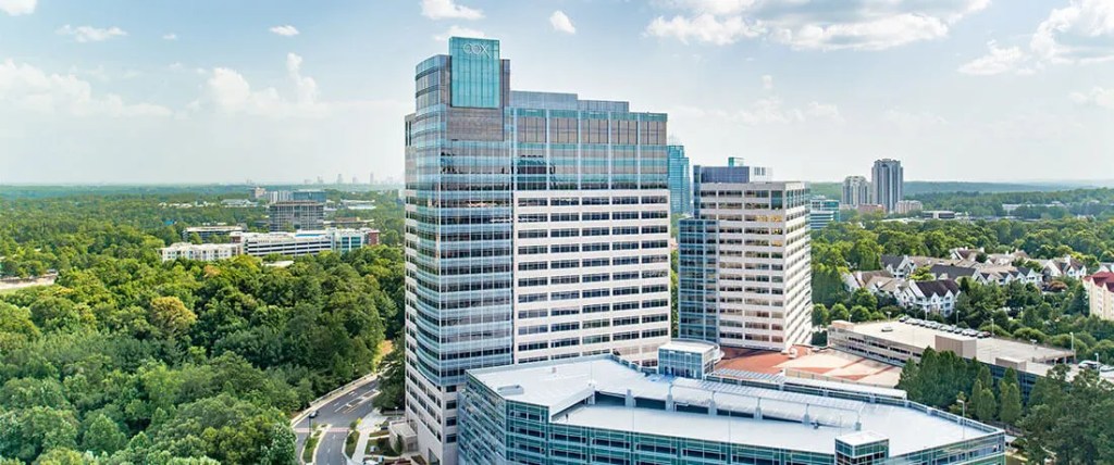 Exterior of a large Cox building.