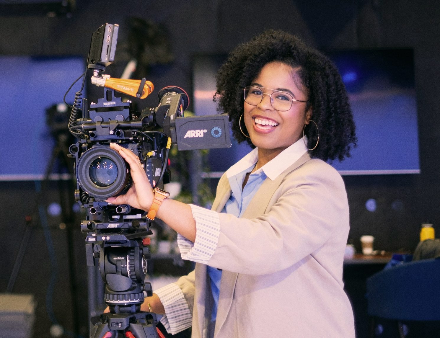 Axios employee operating camera in newsroom studio