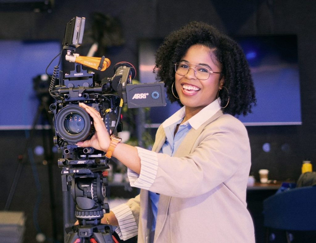 Axios employee operating camera in newsroom studio