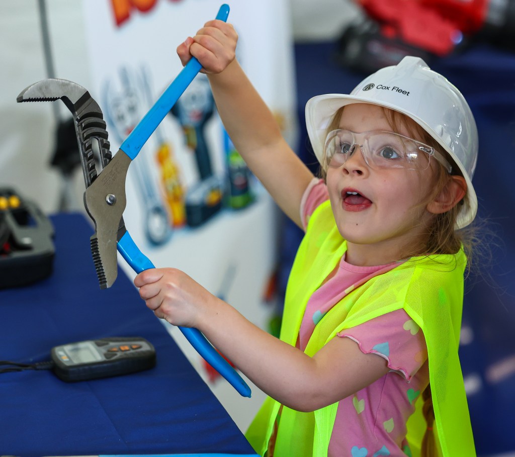 A child exploring fleet tools during the Atlanta Science Festival